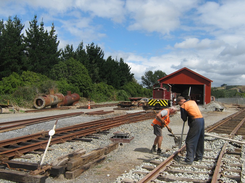 John and Hugh tamping ballast on turntable road, Tr189 in background