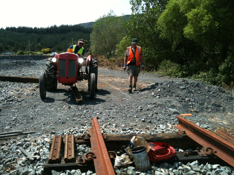 Length of rail slowly brought into position with tractor