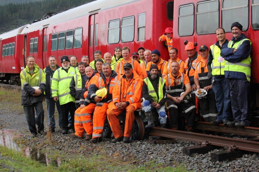 Once Cyclops was safely on site all involved took time out for a group shot. Personnel from KiwiRail, Wellington Heritage Multiple Unit Preservation Trust and Rimutaka Incline Railway Heritage Trust. Thanks to all! Photo: KiwiRail Ltd.