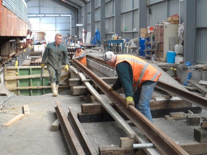 John, Bruce and Colin positioning rails onto road 1 pit