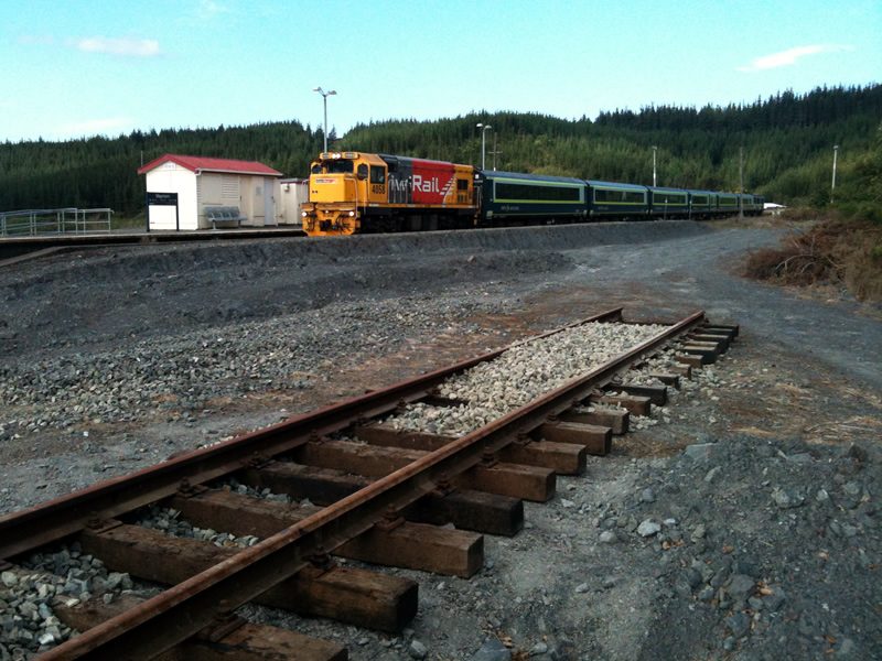The evening south-bound Wairarapa passenger service passes through Maymorn, with newly laid track in foreground.