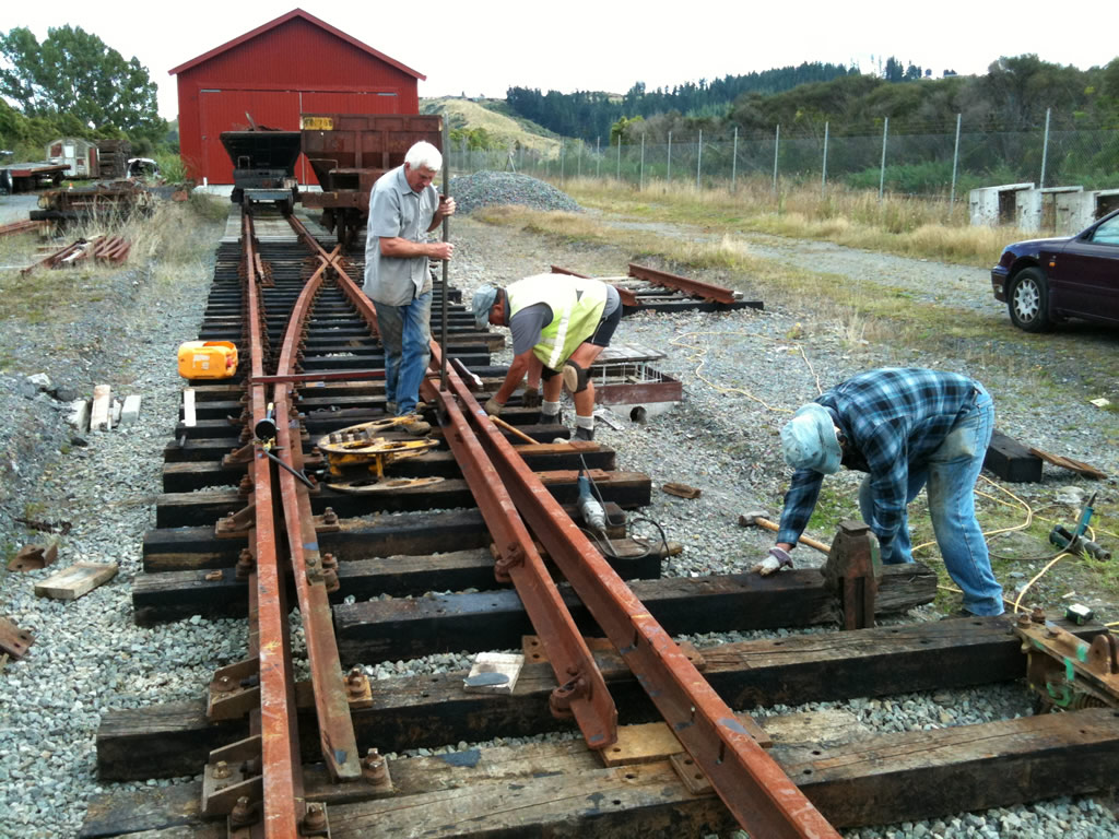 Lionel, Colin and Steve work on road 1 turnout