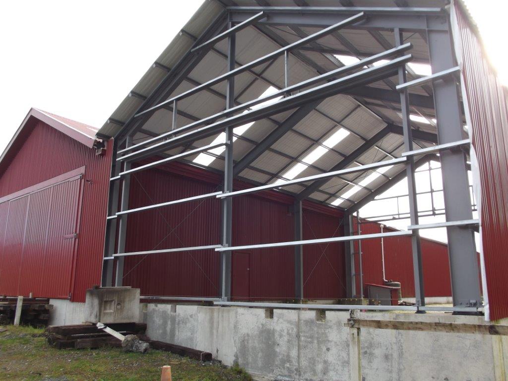 workshop structure with all roof installed and south wall clad