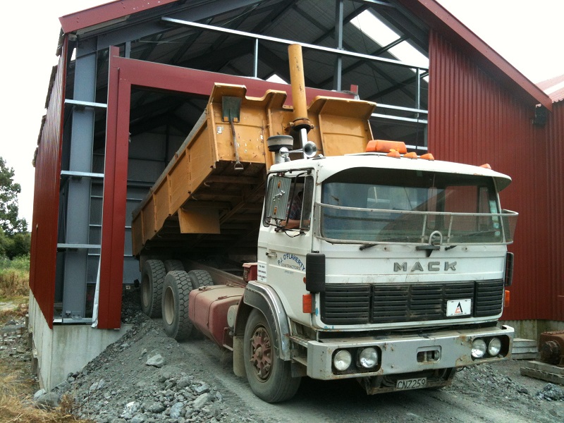 Another truck load of hard fill dumped into the workshop foundations through the train door frame