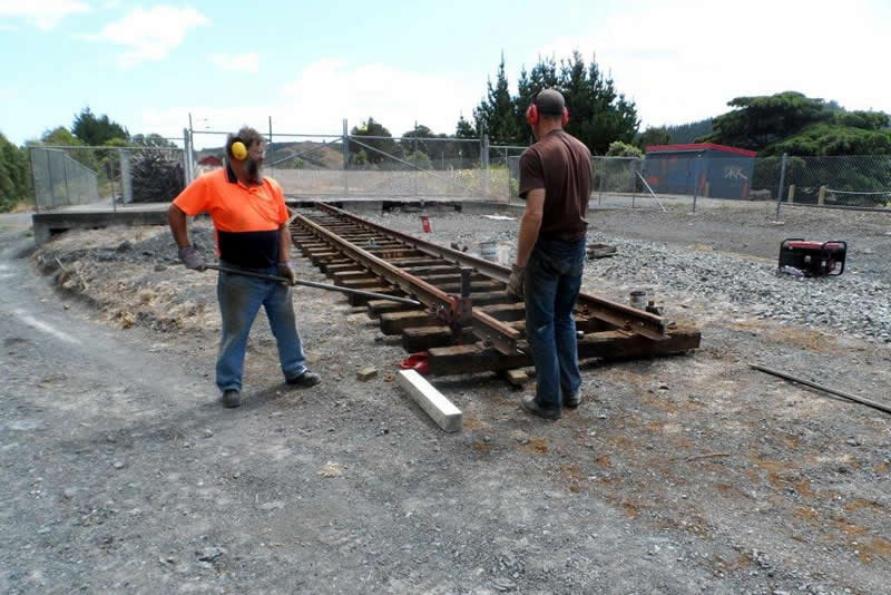 Ray and Hugh bring track to level after fitting sleepers
