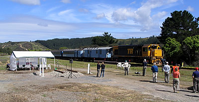 event attendees arriving by scheduled passenger train pass the launch site. 