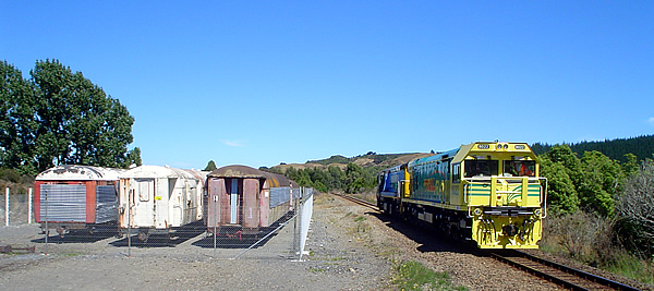 DXR8022 passes the nearly-completed carriage fence.