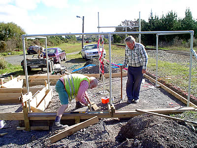 Steve Porter and Ian Shore working on boxing, Maymorn pedestrian crossing. 