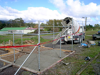 ready-mix concrete being placed to the form pavement surface. 
