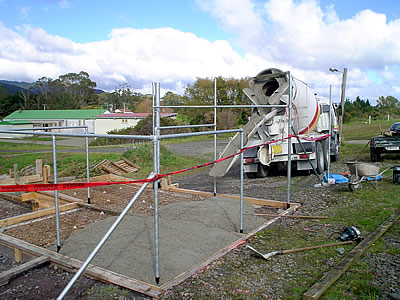 ready-mix concrete being placed to the form pavement surface.