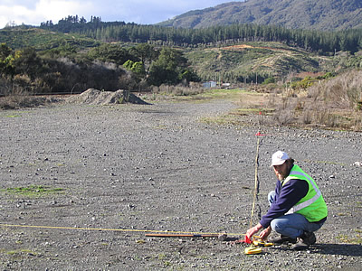 Colin Craddock assisting with surveying work, Maymorn yard. 