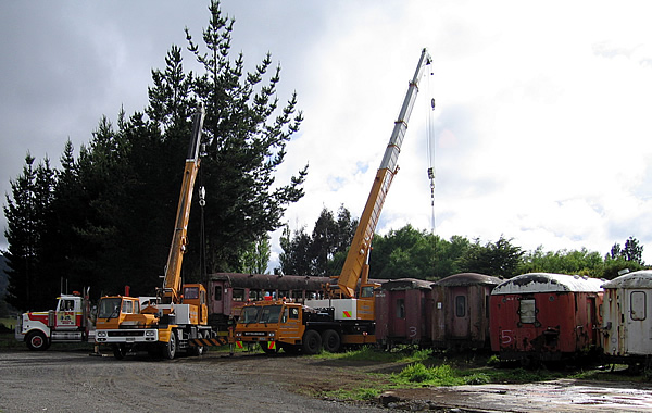Cranes lifting carriage onto truck at Ohakune. 