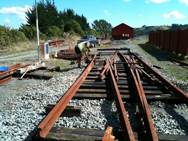 Colin crowing outer slip rails to required curvature through portion adjacent to slip frogs on 17 March 2012. Photo: Hugh McCracken.