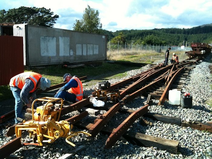 Steve and John work on frog components for double slip