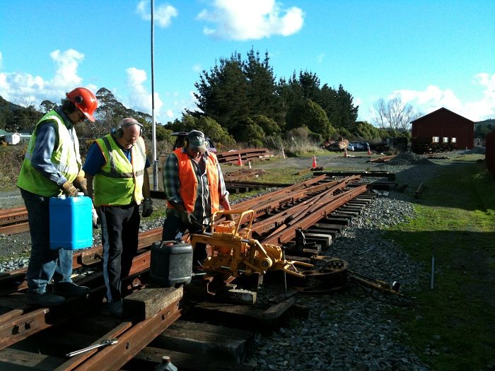 Glenn, Peter and Colin cutting outer slip rail