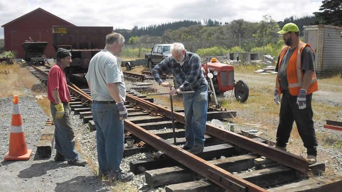 Spock, Rob, Steve and Ray fastening down rails connecting the existing road 1 and road 2 turnouts in front of the shed on 1 December 2012. Photo: Glenn Fitzgerald.