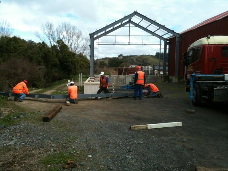 Trust members assembling a portal frame, which arrived in two halves.