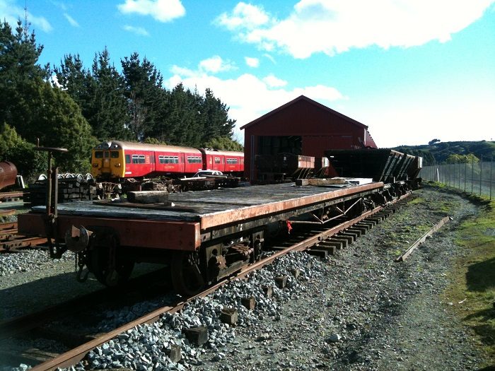 Carriage underframe and rake of wagons on the turntable road. Cyclops and the rail vehicle shed in the background. Photo: Hugh McCracken