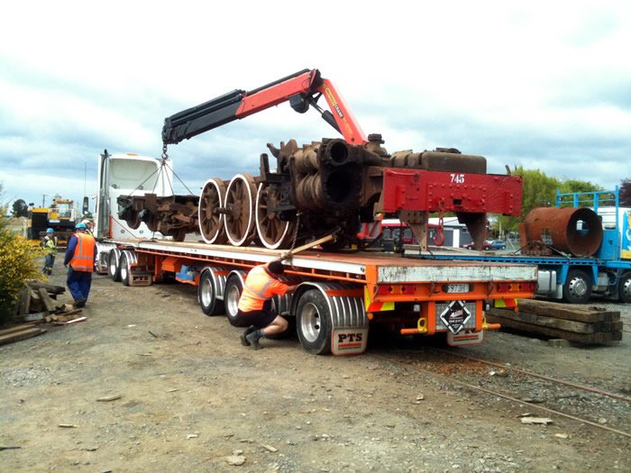 Frame of Ab745 loaded onto a long quad-trailer at Stratford on Tuesday 29th