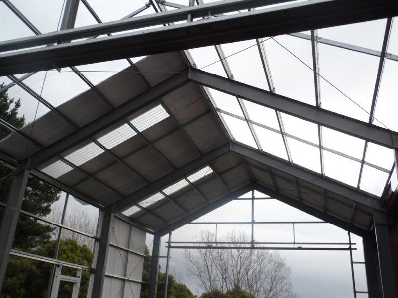 An internal view of the workshop structure, showing the roof and wall cladding installed to date.