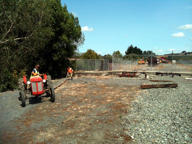 Glenn and John bring a 12m length of 50kg/m rail to the head of steel