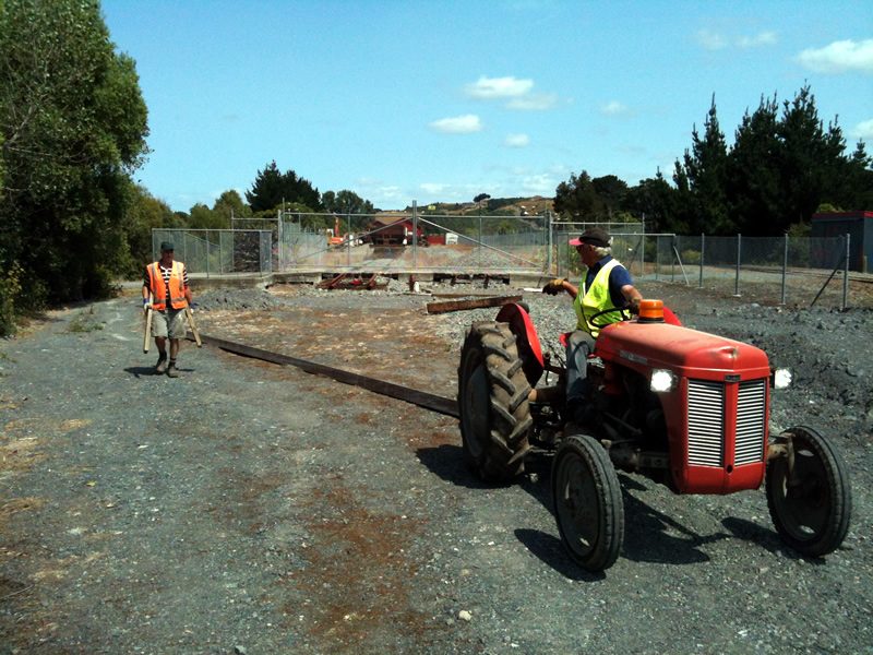 Glenn and John prepare to drag the rail down the formation to join on to existing track