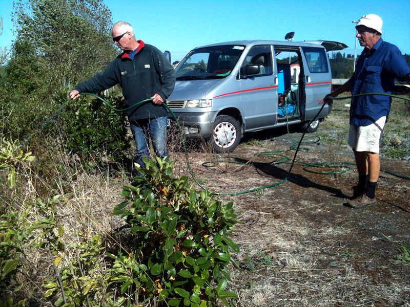 Water is carried to the trees in 200L drums stowed in the van, with a small petrol-powered pump boosting the water pressure.