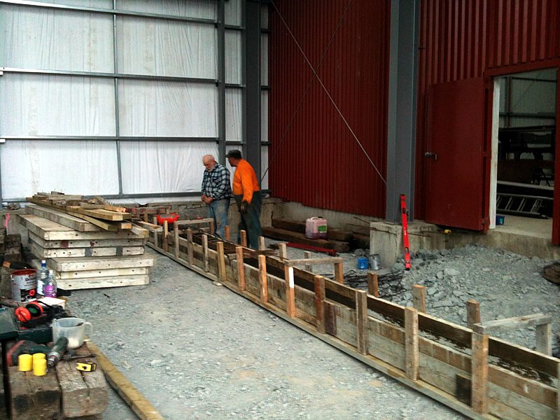 Steve and Colin working on reinforcing and concrete formwork in the workshop