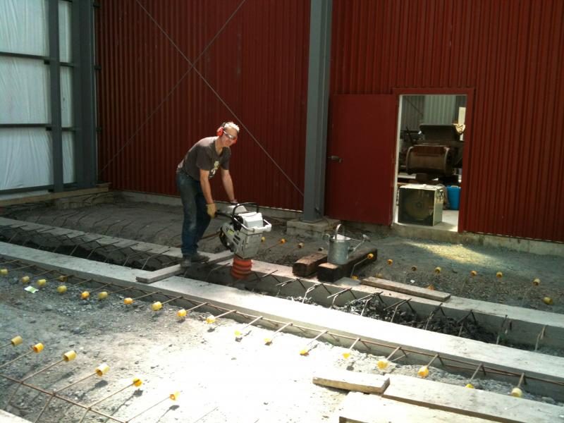 Compacting fill between rail beams on 7 November 2015.