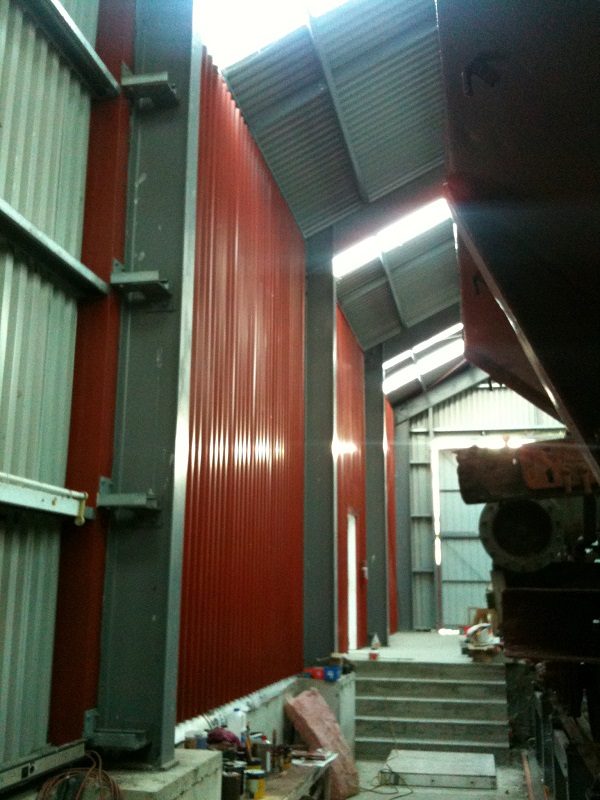 All cladding in place for the three bays between the workshop and the main shed