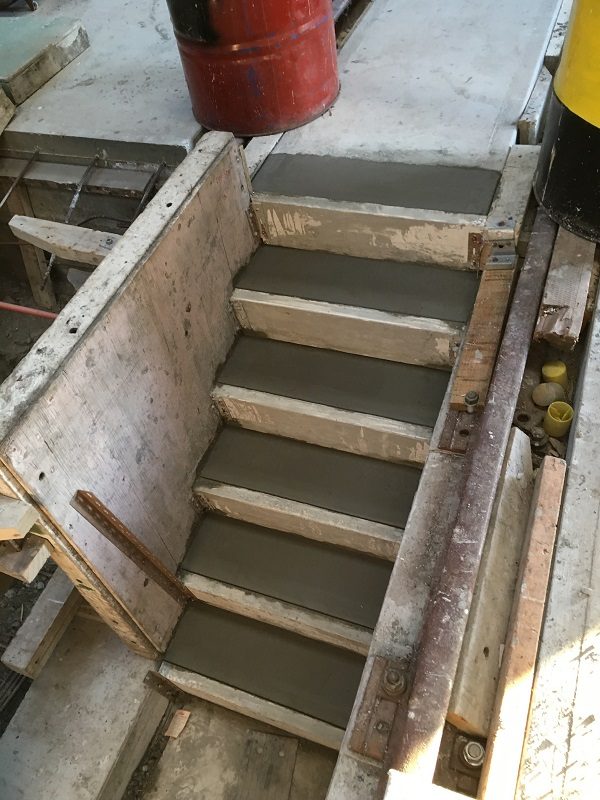 Flight of stairs down into road 1 of the inspection pits