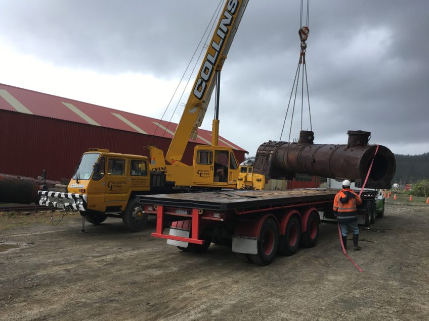 Collins crane unloading replacement boiler from STL Linehaul truck