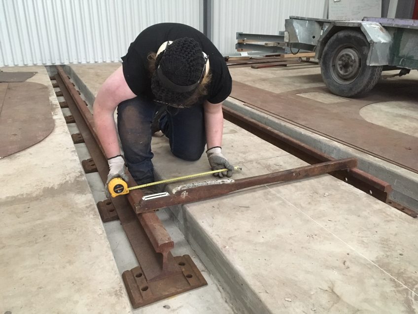 Fitting rails to workshop floor