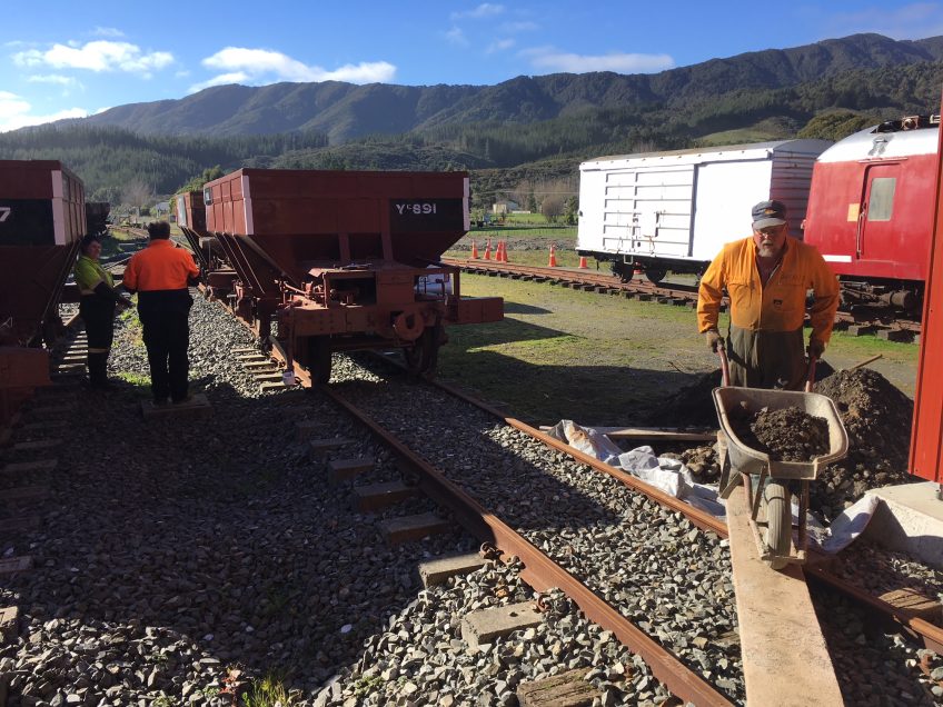 Ray and Lauren working on Yc 891, Colin moves back fill into shed