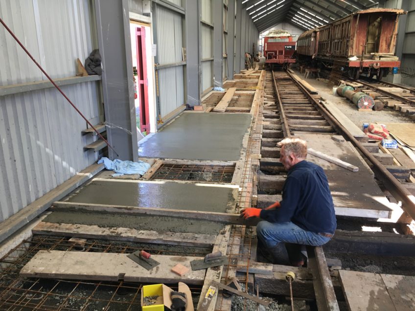 Bruce finishing off concrete placing with screed