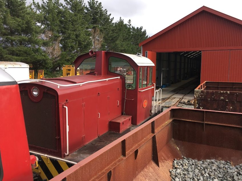 Tr189 with a passenger service stops short of the rail vehicle shed.