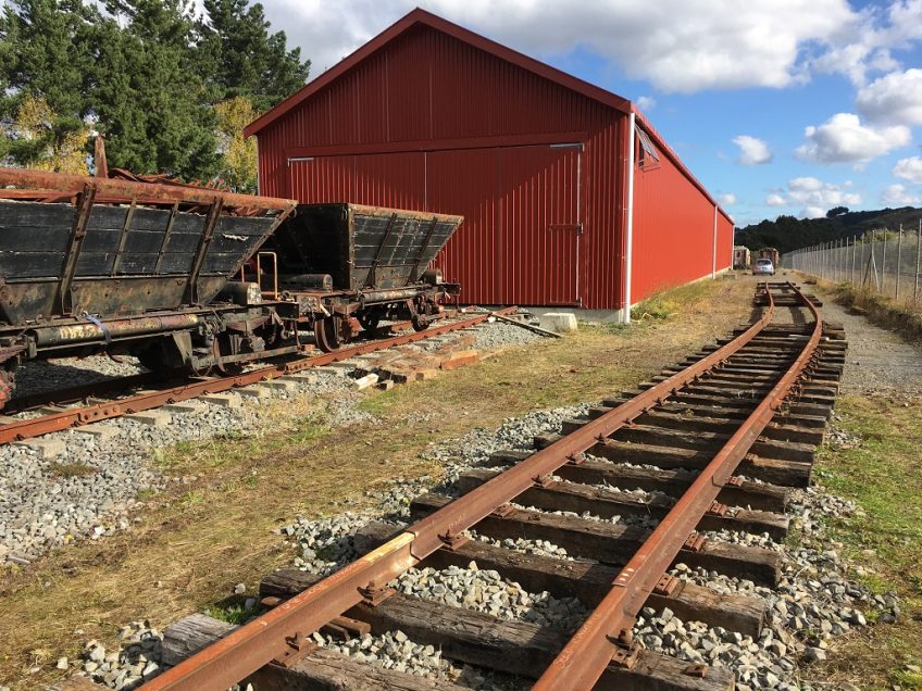 Track extending past the rail vehicle shed
