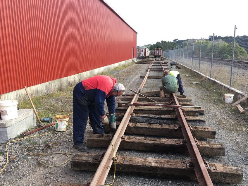 Track work passing the mid-point of the shed