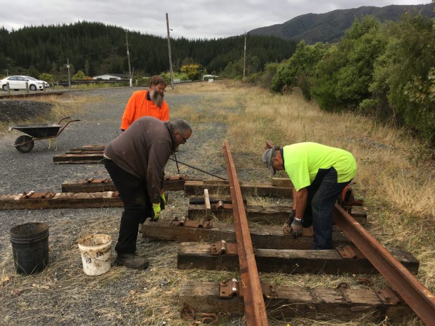 Brendan, Colin and Ray installing sleepers at the railhead on 20 March 2021