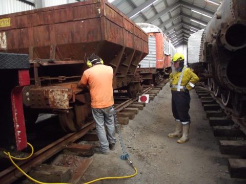 De-scaling rust and old paint from another ballast wagon