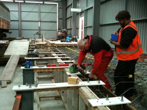 Peter and Ray fitting reinforcing to inspection pit wall